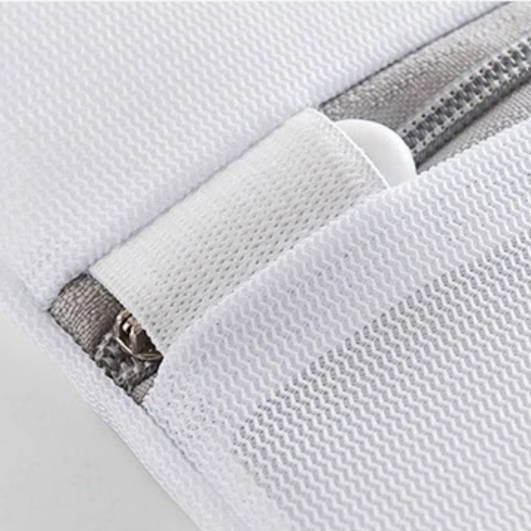 Close-up of a white washing bag zipper