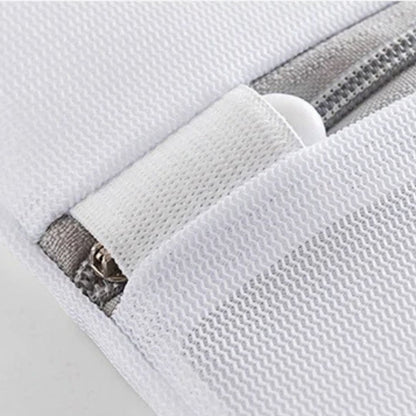 Close-up of a white washing bag zipper